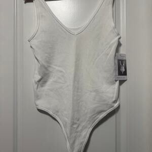 White bodysuit with v neckline and